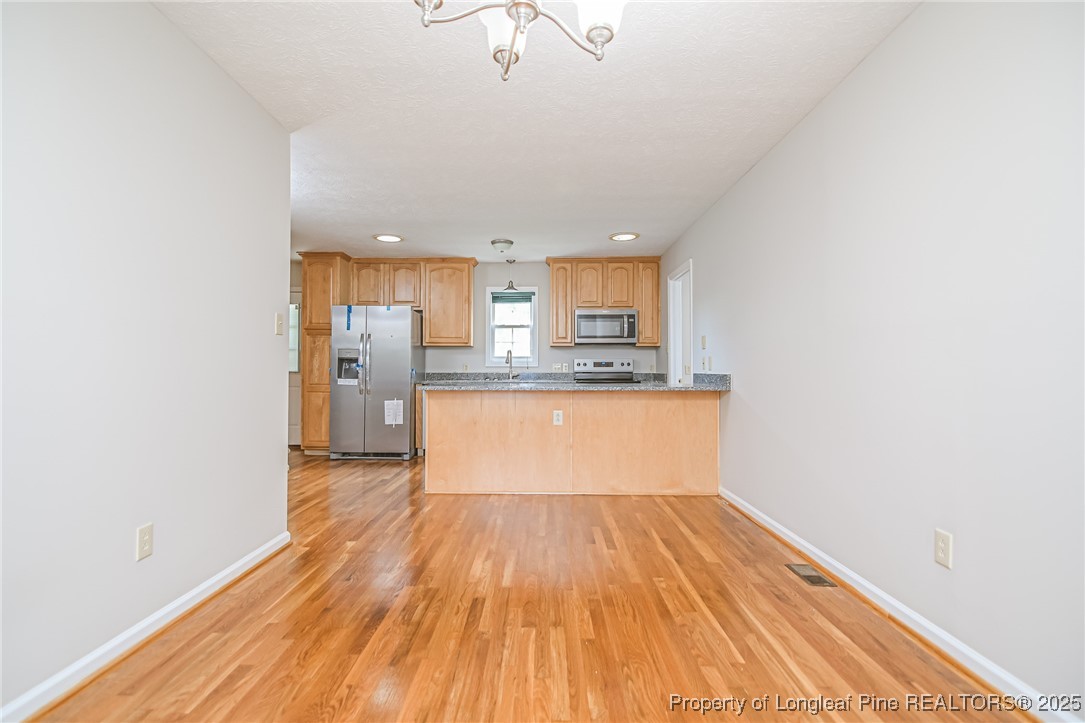 4735 Camden Road Fayetteville, NC 28306 - Photo 18 of 34 a view of kitchen with wooden floor