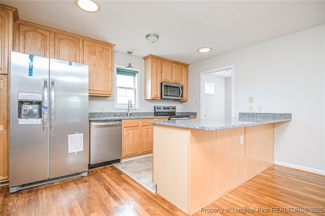 4735 Camden Road Fayetteville, NC 28306 - Photo 19 of 34 a kitchen with stainless steel appliances granite countertop a refrigerator and a sink