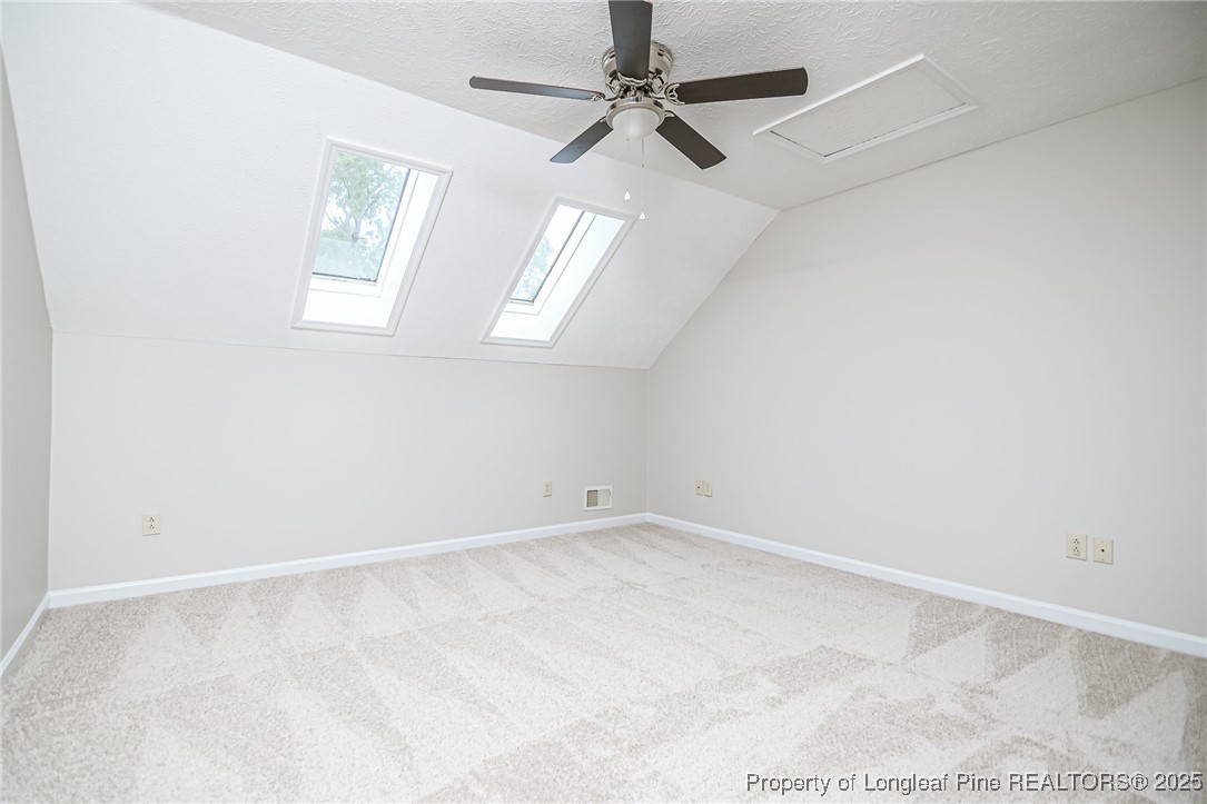 4735 Camden Road Fayetteville, NC 28306 - Photo 25 of 34 an empty room with windows and fan