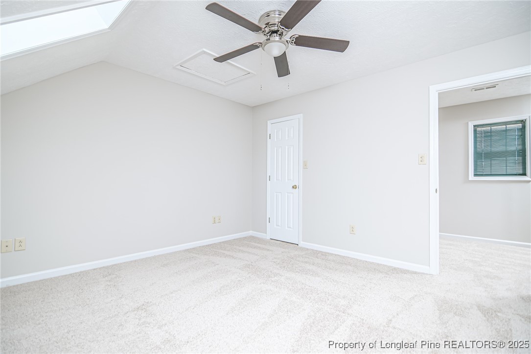 4735 Camden Road Fayetteville, NC 28306 - Photo 26 of 34 an empty room with a ceiling fan and a window