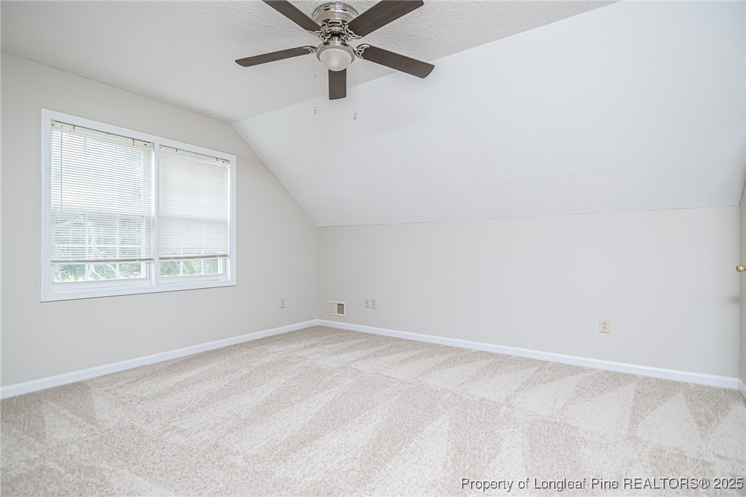 4735 Camden Road Fayetteville, NC 28306 - Photo 27 of 34 an empty room with a window and a fan