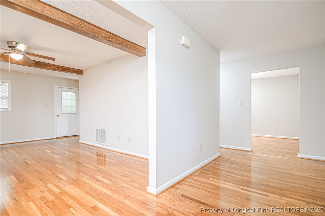 4735 Camden Road Fayetteville, NC 28306 - Photo 3 of 34 a view of an empty room with wooden floor