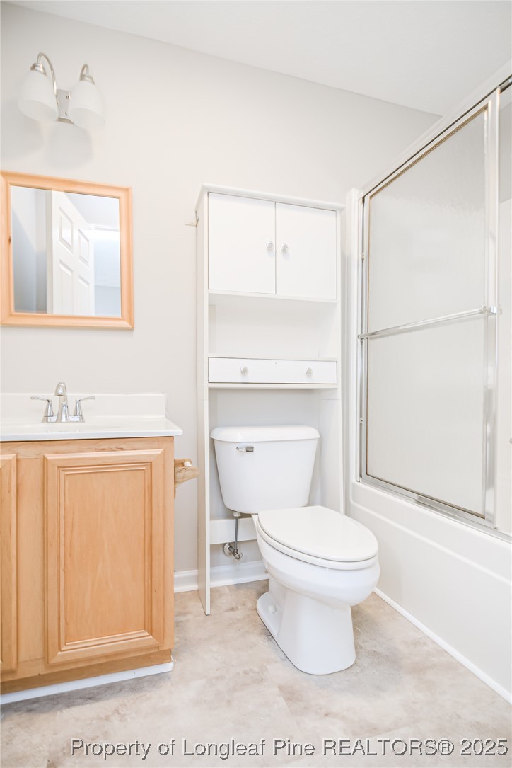 4735 Camden Road Fayetteville, NC 28306 - Photo 31 of 34 a bathroom with a sink a toilet and shower