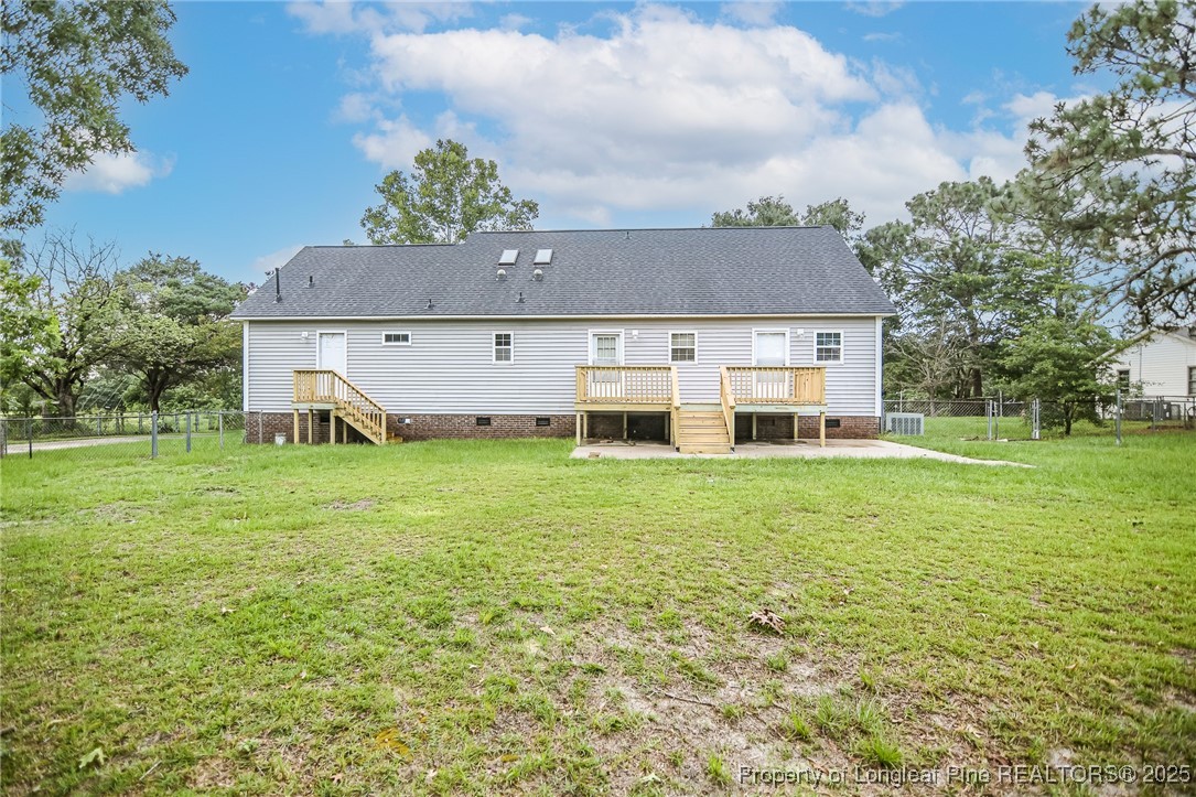 4735 Camden Road Fayetteville, NC 28306 - Photo 34 of 34 a view of a house with a big yard and large trees