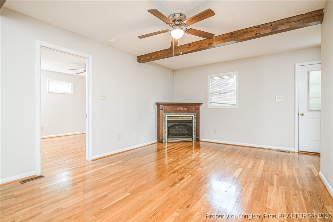 4735 Camden Road Fayetteville, NC 28306 - Photo 6 of 34 a view of an empty room with wooden floor
