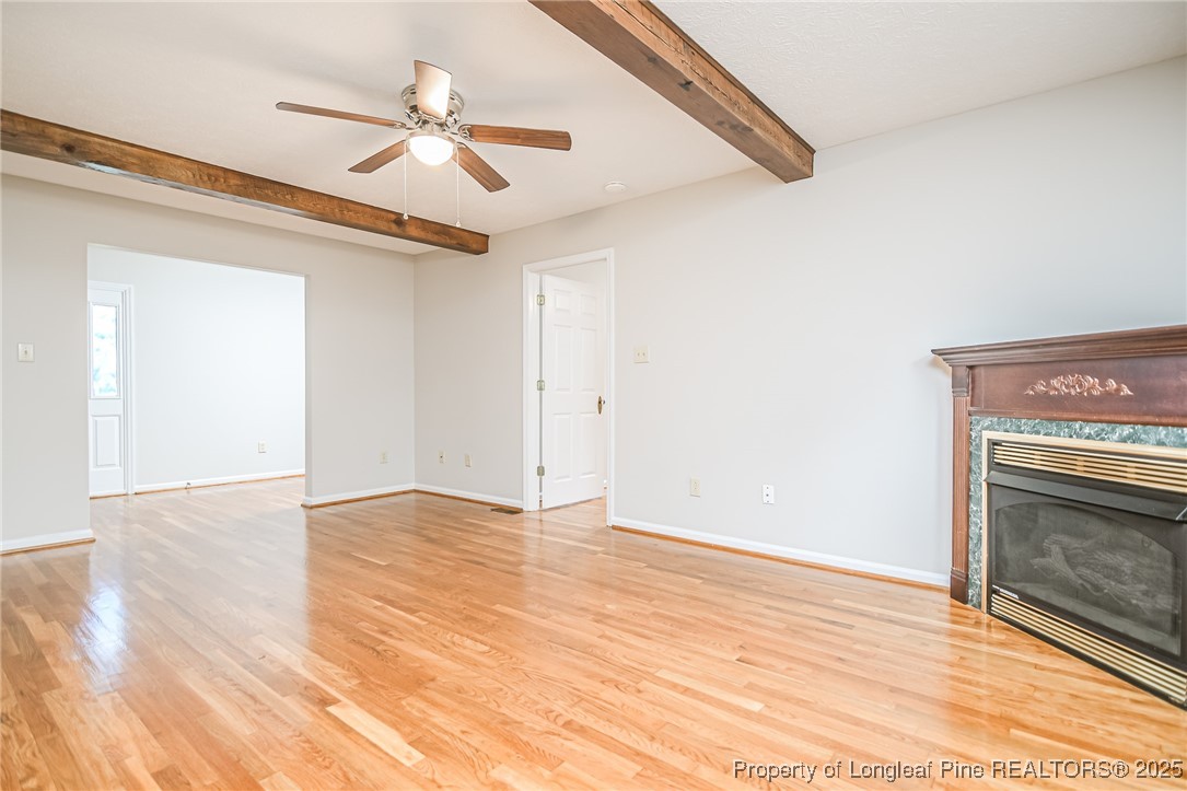 4735 Camden Road Fayetteville, NC 28306 - Photo 7 of 34 a view of empty room with wooden floor and fan
