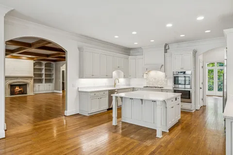 a kitchen with a sink stove and cabinets