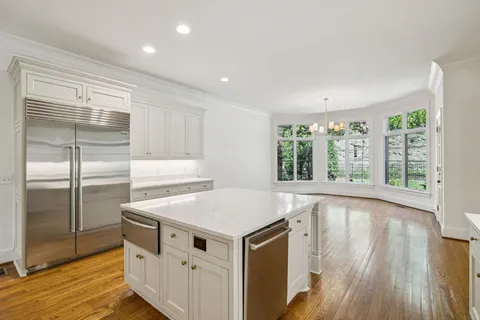a kitchen that has a sink and a stove