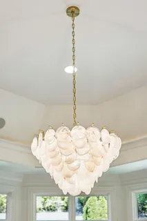 a bathroom with a sink a mirror and a shower