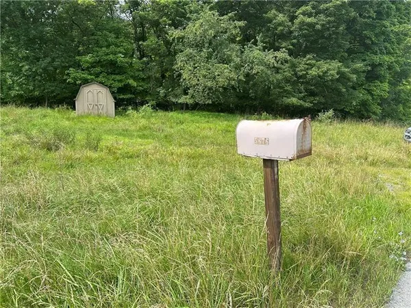 a fire hydrant in the middle of a field