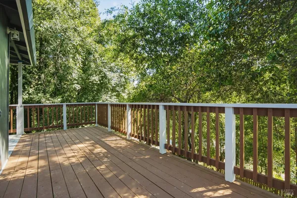 a balcony with wooden floor