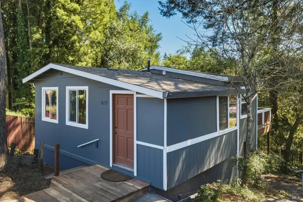 a house with trees in the background