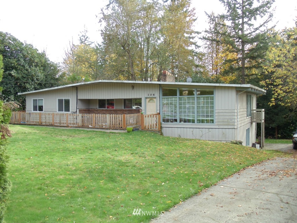 106 243rd Place Southeast Bothell, WA 98021 - Photo 1 of 3 a front view of house with yard and green space
