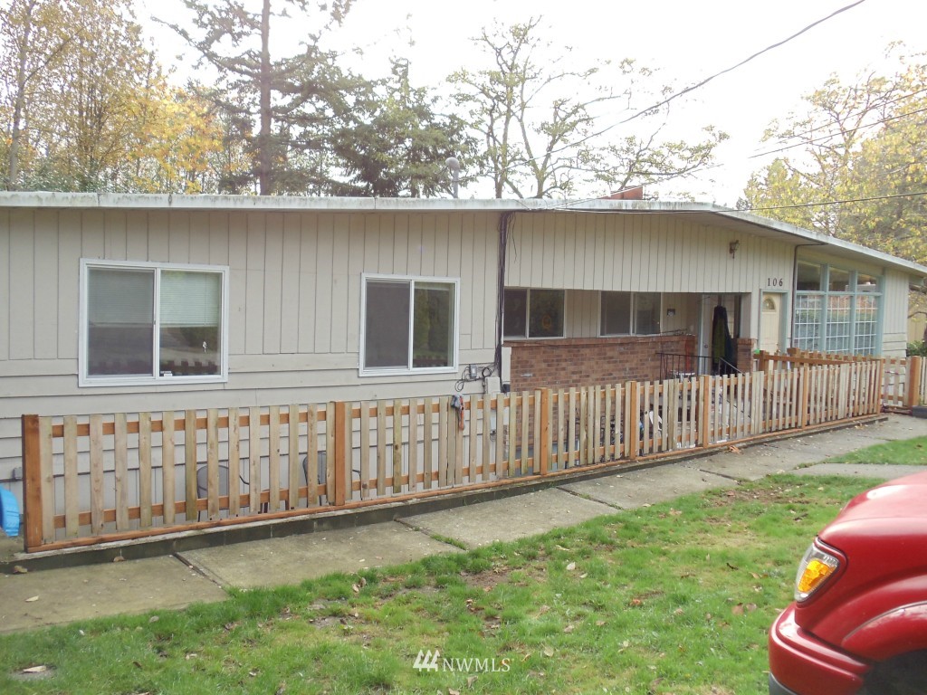 106 243rd Place Southeast Bothell, WA 98021 - Photo 2 of 3 a view of a house with a yard and a fence