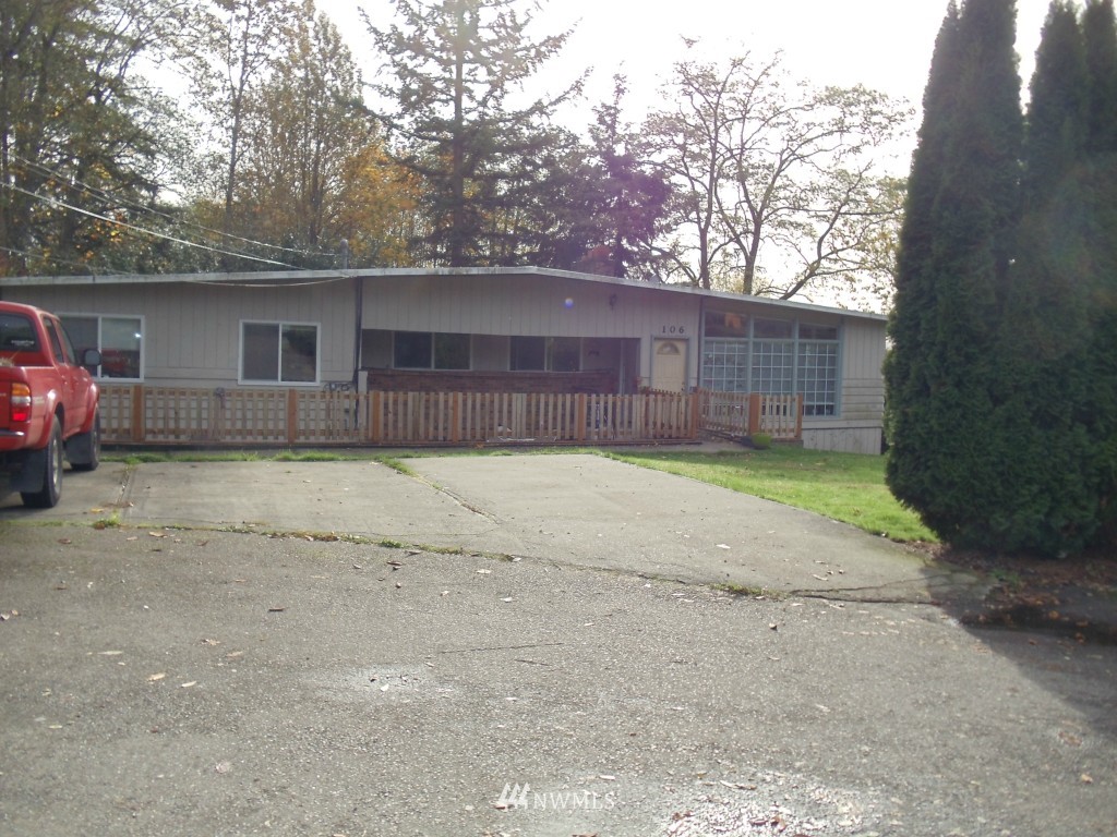 106 243rd Place Southeast Bothell, WA 98021 - Photo 3 of 3 a front view of a house with a yard and garage