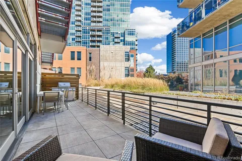 a view of a balcony with chairs