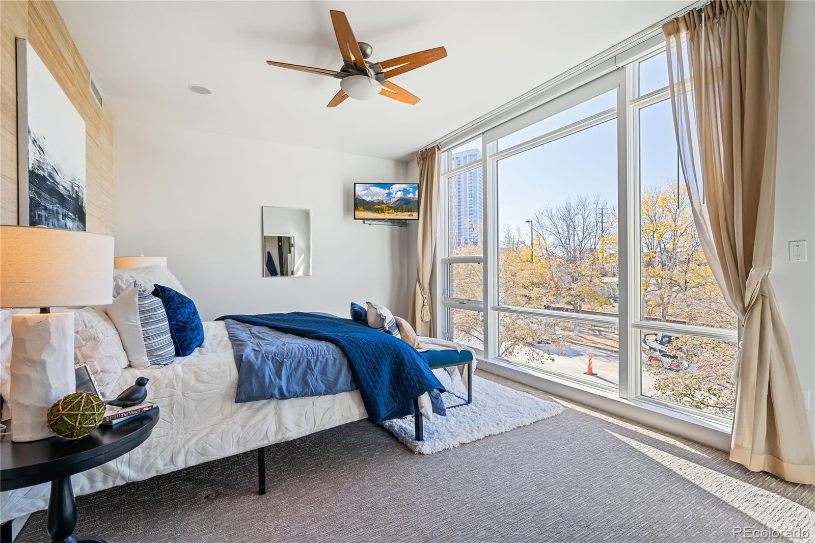 1640 Little Raven Street Denver, CO 80202 - Photo 28 of 47 a bed room with a bed and a window