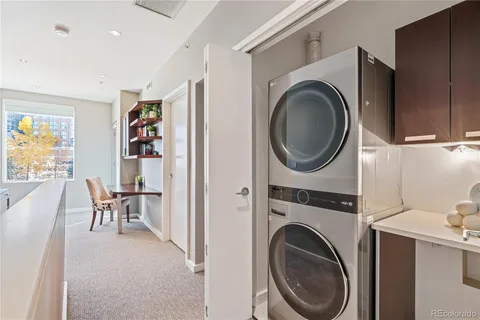 a view of a storage and utility room with washer and dryer