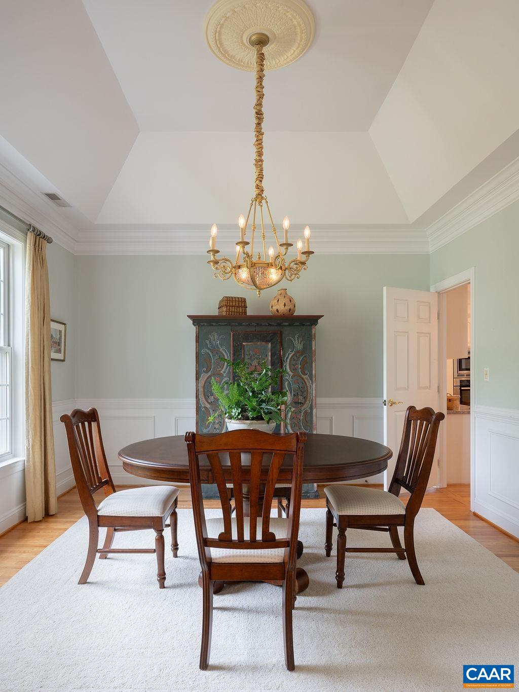 3515 Devon Pines Keswick, VA 22947 - Photo 14 of 68 a view of a dining room with furniture a chandelier and wooden floor