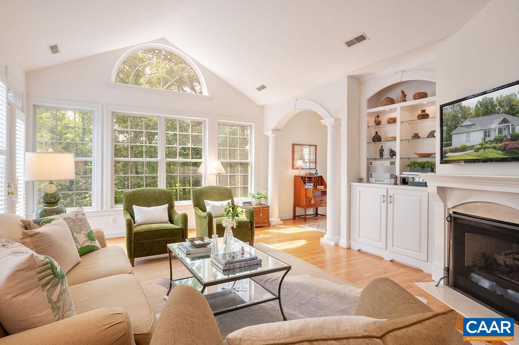 3515 Devon Pines Keswick, VA 22947 - Photo 19 of 68 a living room with furniture a large window and a fireplace
