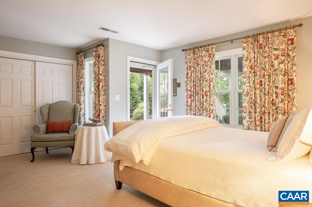 3515 Devon Pines Keswick, VA 22947 - Photo 42 of 68 a bedroom with a bed and a chair