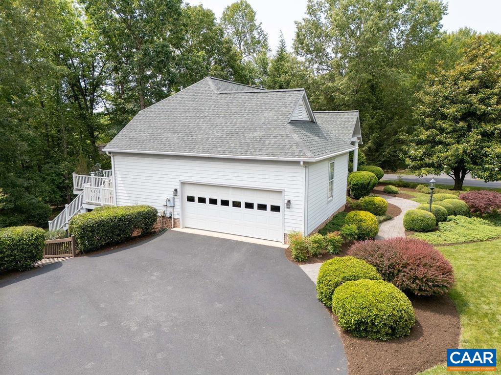 3515 Devon Pines Keswick, VA 22947 - Photo 59 of 68 a view of a house with a yard and a garage