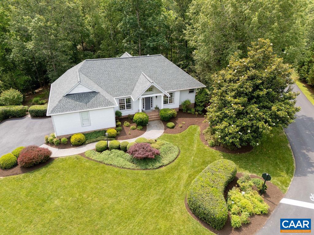 3515 Devon Pines Keswick, VA 22947 - Photo 7 of 68 a aerial view of a house with swimming pool and trees in the background