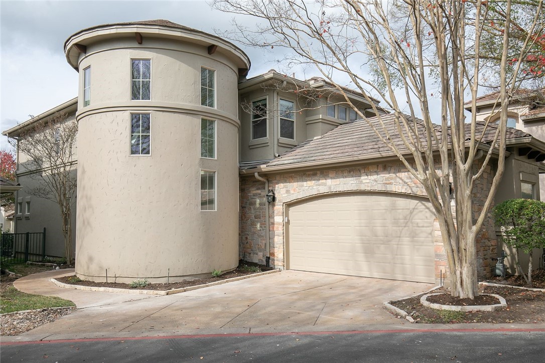 2800 Waymaker Way, Unit 29 Austin, TX 78746 - Photo 1 of 1 a front view of a house with a yard