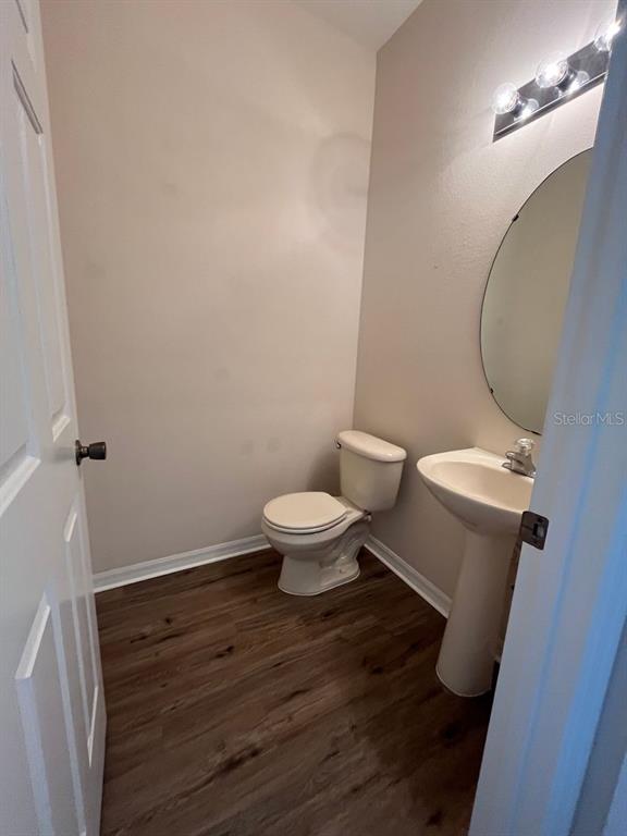 21 Whittingham Lane Palm Coast, FL 32164 - Photo 13 of 34 a white toilet sitting next to a bathroom sink