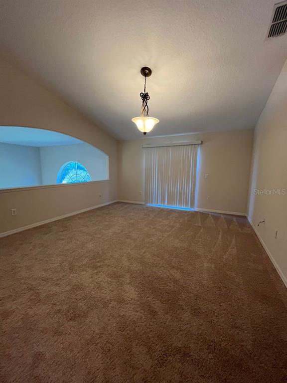 21 Whittingham Lane Palm Coast, FL 32164 - Photo 18 of 34 a view of an empty room with windows