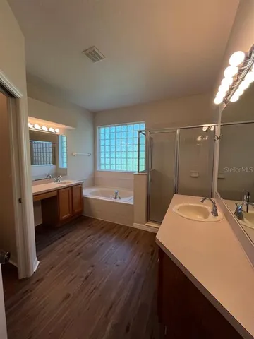 a view of a room with gym equipment and windows