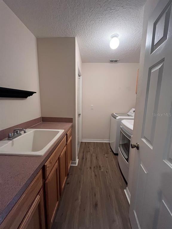 21 Whittingham Lane Palm Coast, FL 32164 - Photo 34 of 34 a room with a sink a toilet and wooden floor