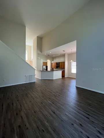 a view of a living room with wooden floor