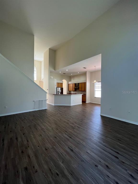 21 Whittingham Lane Palm Coast, FL 32164 - Photo 7 of 34 a view of a living room with wooden floor