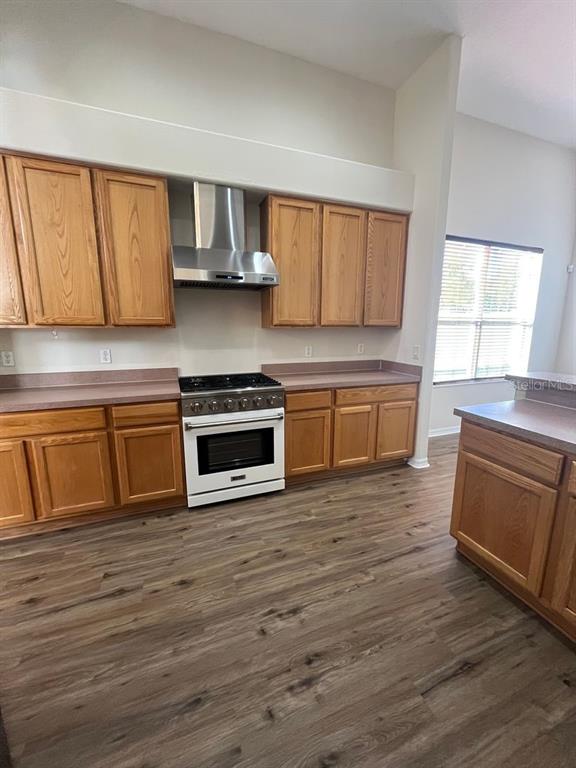 21 Whittingham Lane Palm Coast, FL 32164 - Photo 10 of 34 a kitchen with stainless steel appliances granite countertop a stove a sink and a microwave