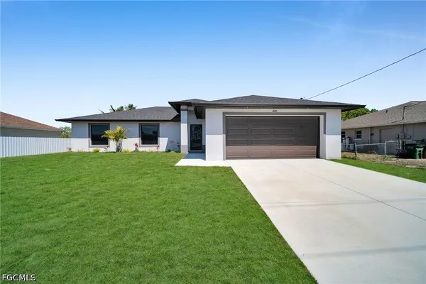 a front view of a house with a yard