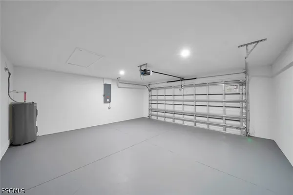 a view of a garage room with white walls
