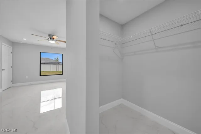 a view of an empty room and bathroom