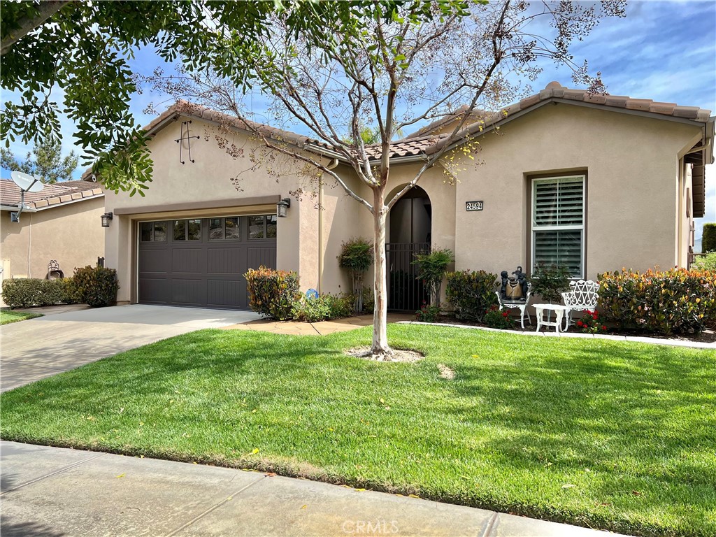 24594 Hatton Lane Corona, CA 92883 - Photo 1 of 57 a house that has a big yard and large trees