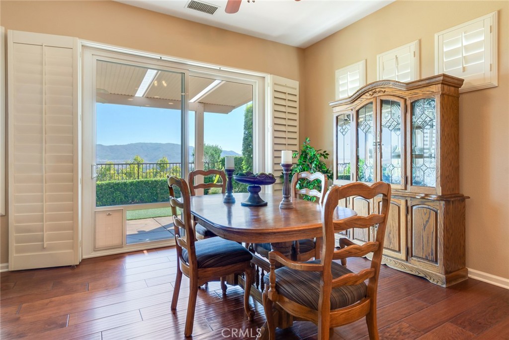 24594 Hatton Lane Corona, CA 92883 - Photo 9 of 57 a dining room with furniture window and wooden floor