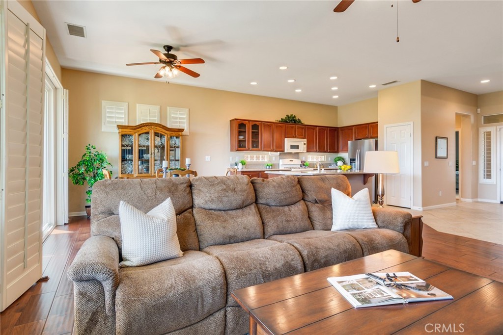 24594 Hatton Lane Corona, CA 92883 - Photo 14 of 57 a living room with furniture and a chandelier