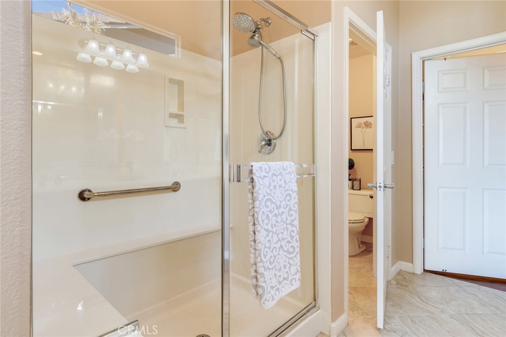 24594 Hatton Lane Corona, CA 92883 - Photo 19 of 57 a bathroom with a shower and a sink