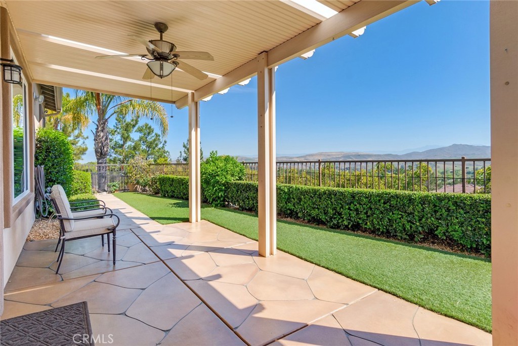 24594 Hatton Lane Corona, CA 92883 - Photo 23 of 57 Panoramic Back Patio Has Maintenance-Free "Alumawood" Cover & Elegant Carved Concrete Decking