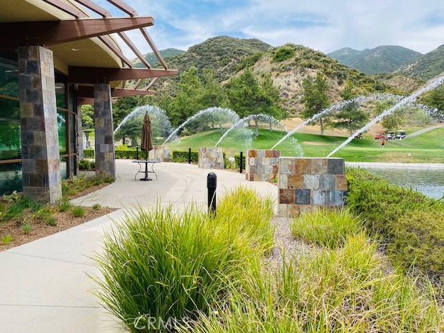 24594 Hatton Lane Corona, CA 92883 - Photo 43 of 57 a view of a patio with a table and chairs under an umbrella