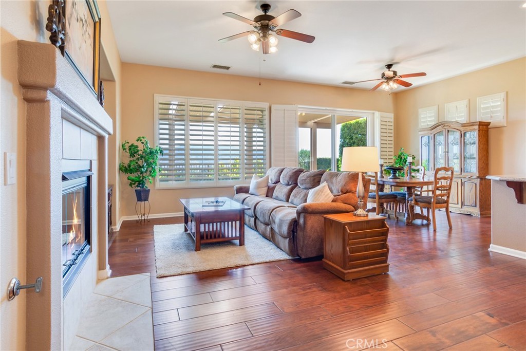 24594 Hatton Lane Corona, CA 92883 - Photo 57 of 57 a living room with fireplace furniture and a large window
