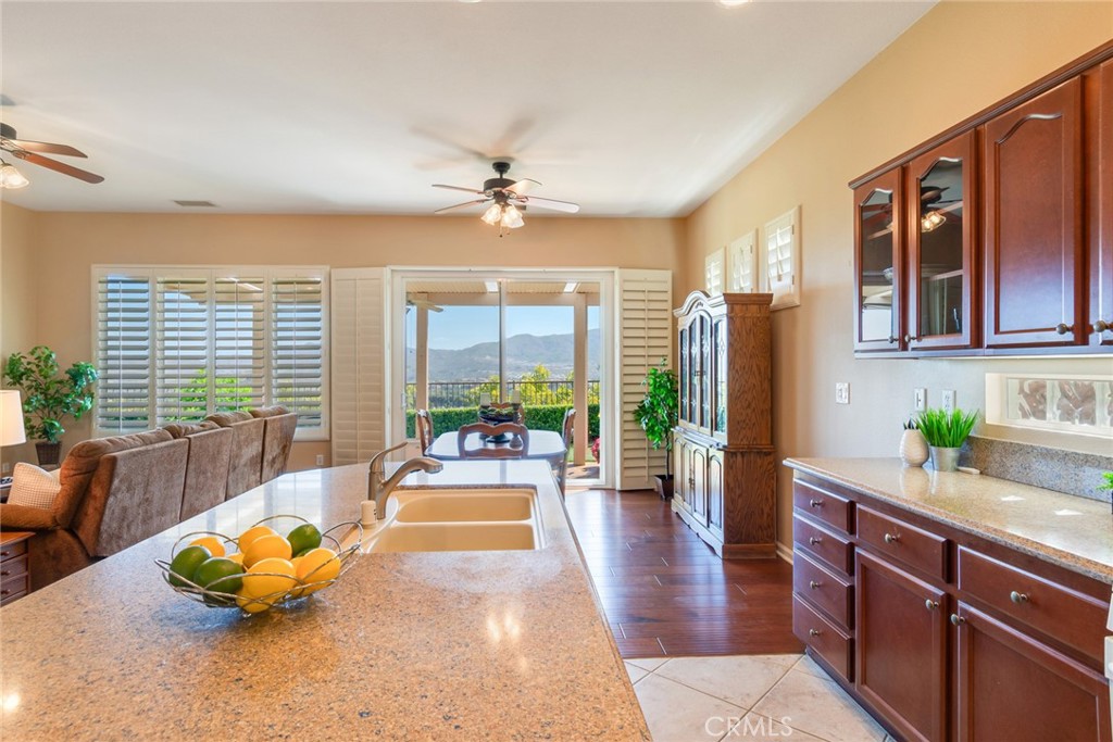 24594 Hatton Lane Corona, CA 92883 - Photo 8 of 57 a living room with furniture floor to ceiling window and wooden floor