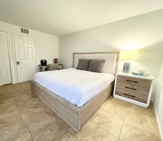 a bedroom with a bed and a cabinets
