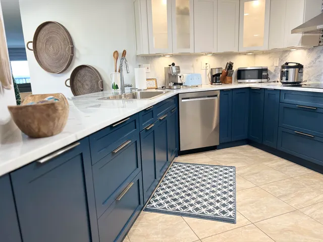 a kitchen with a sink and cabinets