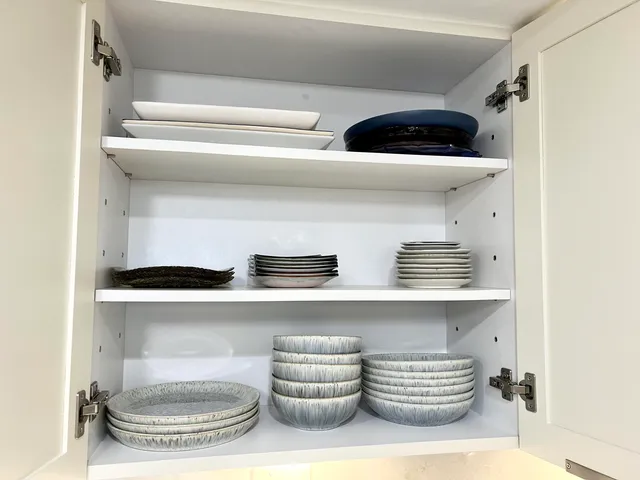 a bathroom with a toilet a sink and a window