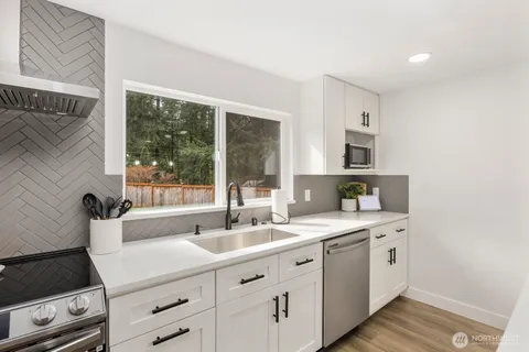 a kitchen with a sink and cabinets